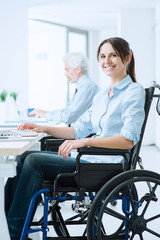 Smiling business woman in wheelchair