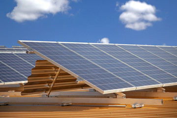 solar panels on roof against blue sky