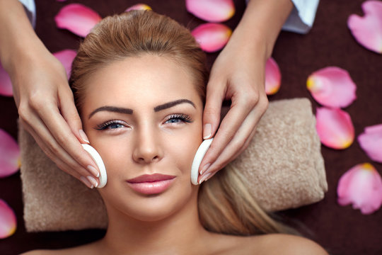 Young pretty woman on professional face treatment
