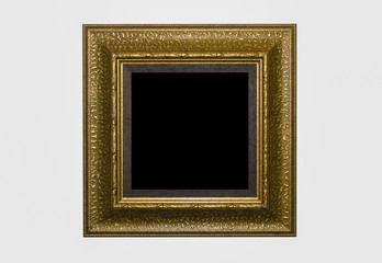 Gold vintage wooden photo frame isolated on white background.