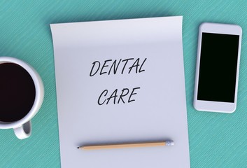 DENTAL CARE, message on paper, smart phone and coffee on table, 3D rendering