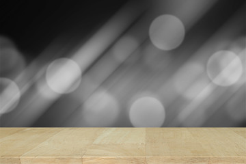 Wooden desk with Grey gradient blurred abstract background.