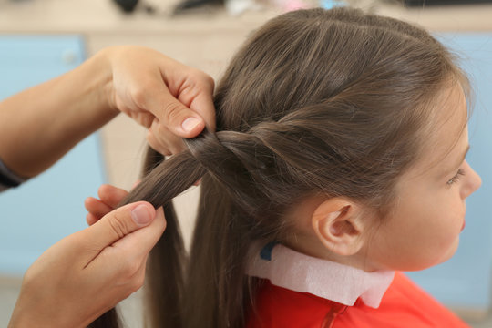 Small girl in hairdressing salon