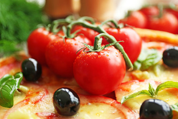 Delicious pizza with fresh tomatoes, close up