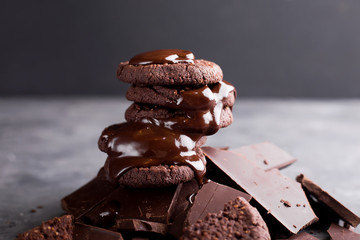 Chocolate cookies with melted chocolate and a slide of chocolate