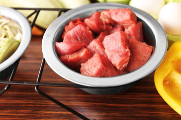 Healthy dog food on wooden background