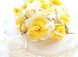 Beautiful wedding cake decorated with roses, closeup