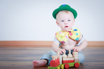 six months child with clown Hat