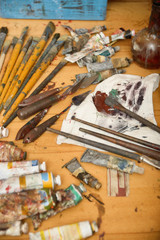 scattered on the table tools of the painter