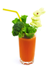 carrot juice in a glass on a white background