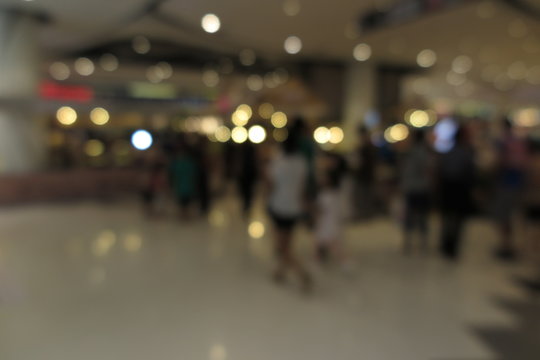 Shopping mall, modern trade with people in blur background with bokeh