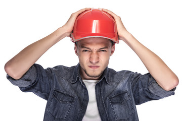 Young man in a construction helmet.