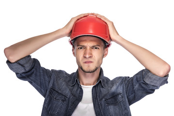 Young man in a construction helmet.