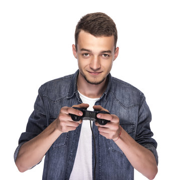 Young man playing on console or computer.