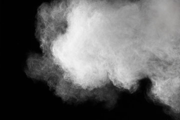 Freeze motion of white dust explosions isolated on black background