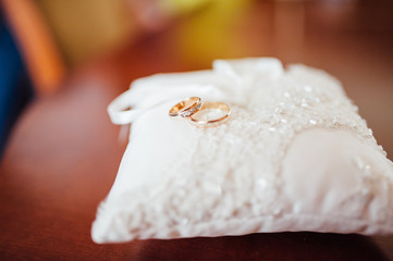 pair of wedding rings with bokeh background