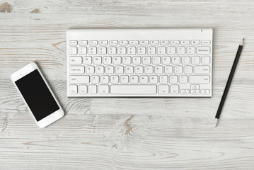 Workstation at a white rustic wooden desk