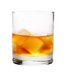 Glass of whiskey with ice isolated on white background