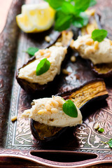 the baked eggplants with goat  cheese and tahini dip