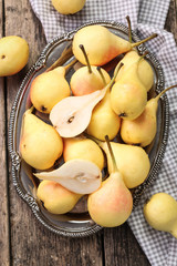 ripe pears on vitage wooden table