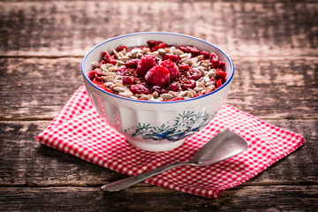 Breakfast banana smoothie bowl topped with goji berries,raspberry