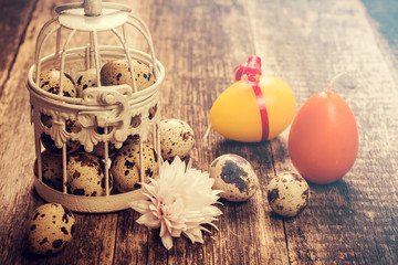Easter background with colorful eggs on wooden table .