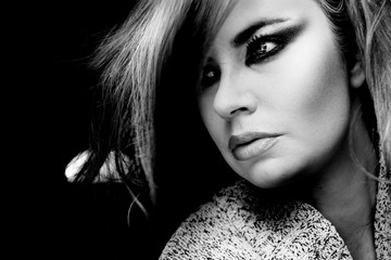 Elegant portrait of young woman looking at camera, expression, fashion, emotion