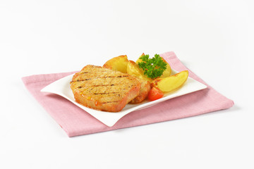 Grilled pork chops with potato wedges