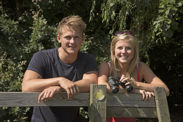Couple in Hampshire countryside England UK - A young couple walking on farmland in the English countryside © petert2