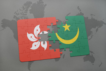 puzzle with the national flag of hong kong and mauritania on a world map background.