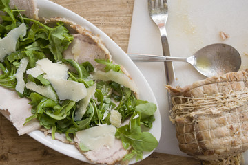 roast chine of pork with arugula and parmesan