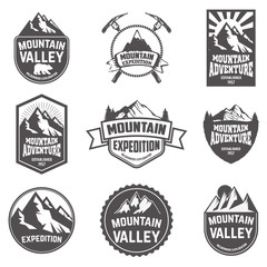 Hiking, mountains exploration labels and emblems.