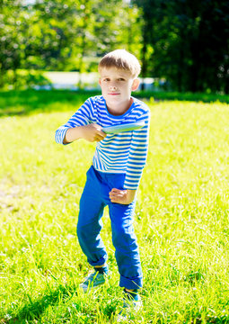 Boy playing frisbee