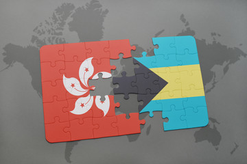 puzzle with the national flag of hong kong and bahamas on a world map background.