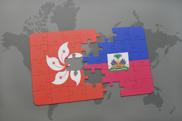 puzzle with the national flag of hong kong and haiti on a world map background.
