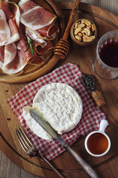 Camembert cheese, cold cuts and red wine