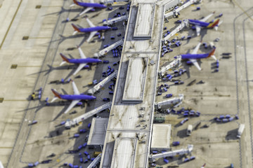 Airport terminal aerial view with planes. Tilt shift effect