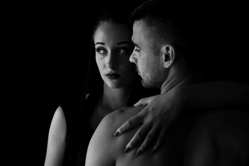 Two lovers over dark background