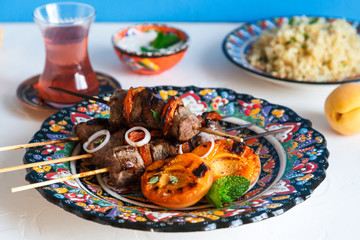 Lamb kebab with dried apricot, bulgur and rose tea
