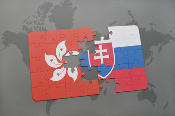 puzzle with the national flag of hong kong and slovakia on a world map background.