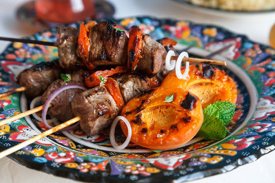 Lamb kebab marinated with yoghurt  apricots served on traditional plate