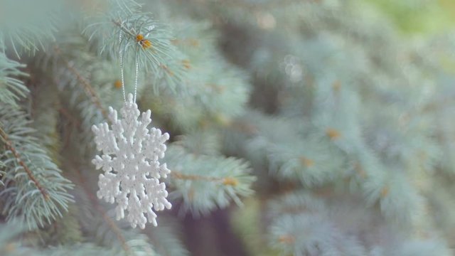 Decorated Christmas tree on blurred, sparkling and fairy background