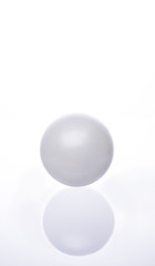 White pearl on white background / Christmas ball on the Christmas tree.