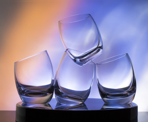 Glasses for brandy / Transparent glass on a colorful background