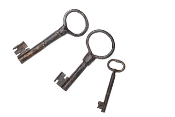Three old vintage keys isolated on a white background