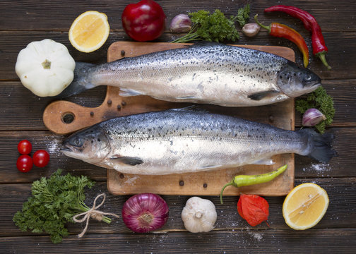 Cooking background, fish on the blackboard, top view