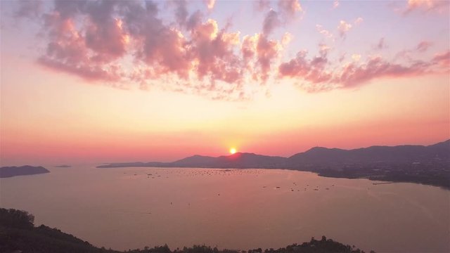 aerial photography on khao khad view point Phuket.sunset at Khao Khad view point the sun going down to the roof view point building Khao Khad view point can  see around Phuket island 360 degree