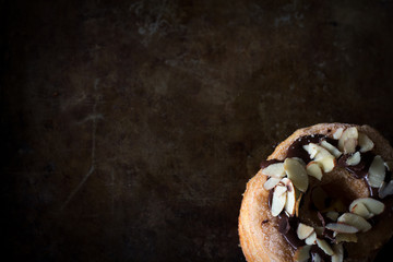 Rustic Cronut from Above on Dark Background with Copy Space