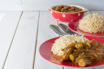 Middle Eastern Bamiya with Rice on White Table with Copy Space Horizontal