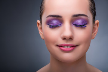 Fototapeta premium Young woman in beauty concept with nice make-up